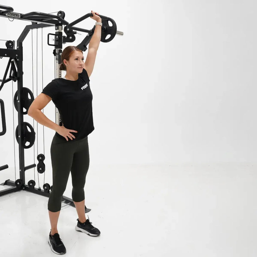 Force USA G9 and G12 Jammer Arms attached to the All-In-One Trainer, demonstrating bench press exercise.