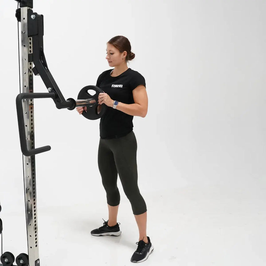 Force USA G9 and G12 Jammer Arms attached to the All-In-One Trainer, demonstrating bench press exercise.