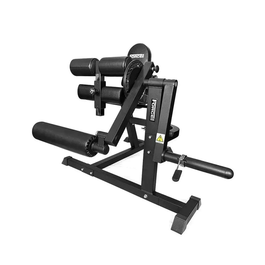 Force USA quadriceps and leg curl machine with adjustable padding and a sturdy steel frame for versatile leg training.