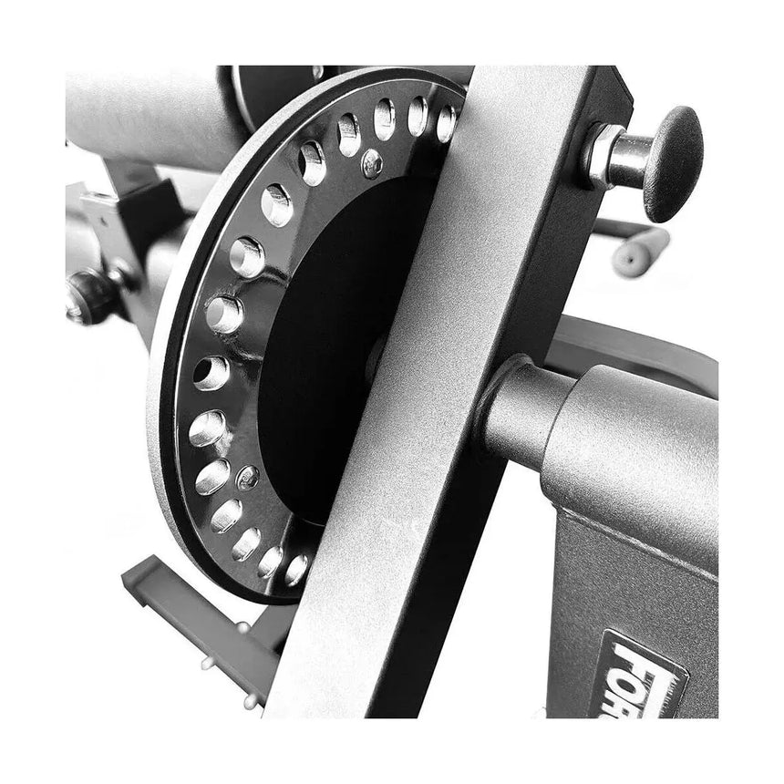 Force USA quadriceps and leg curl machine with adjustable padding and a sturdy steel frame for versatile leg training.