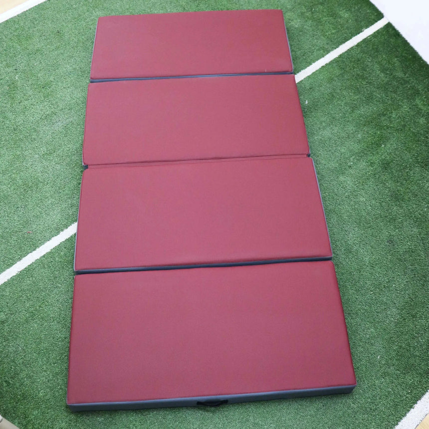 HEGREN Foldable Pilates Mat in blue, featuring high-density foam and synthetic leather upholstery, folded for easy transport.