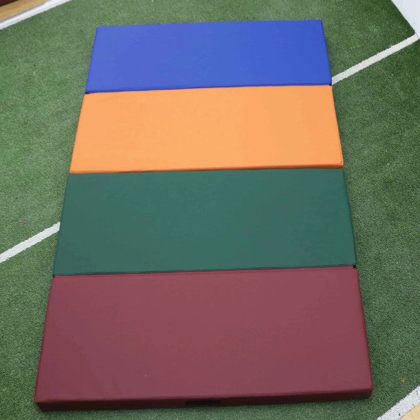 HEGREN Foldable Pilates Mat in blue, featuring high-density foam and synthetic leather upholstery, folded for easy transport.