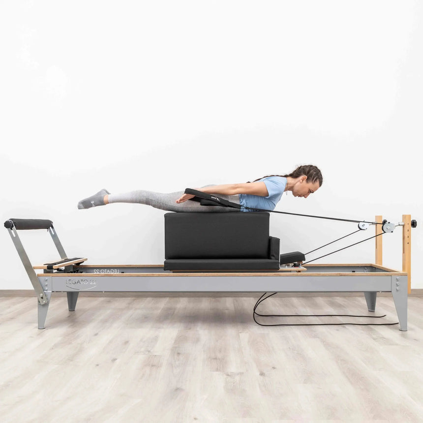 HEGREN Box Modern placed on a Pilates Reformer, showcasing its cushioned surface and modern design.