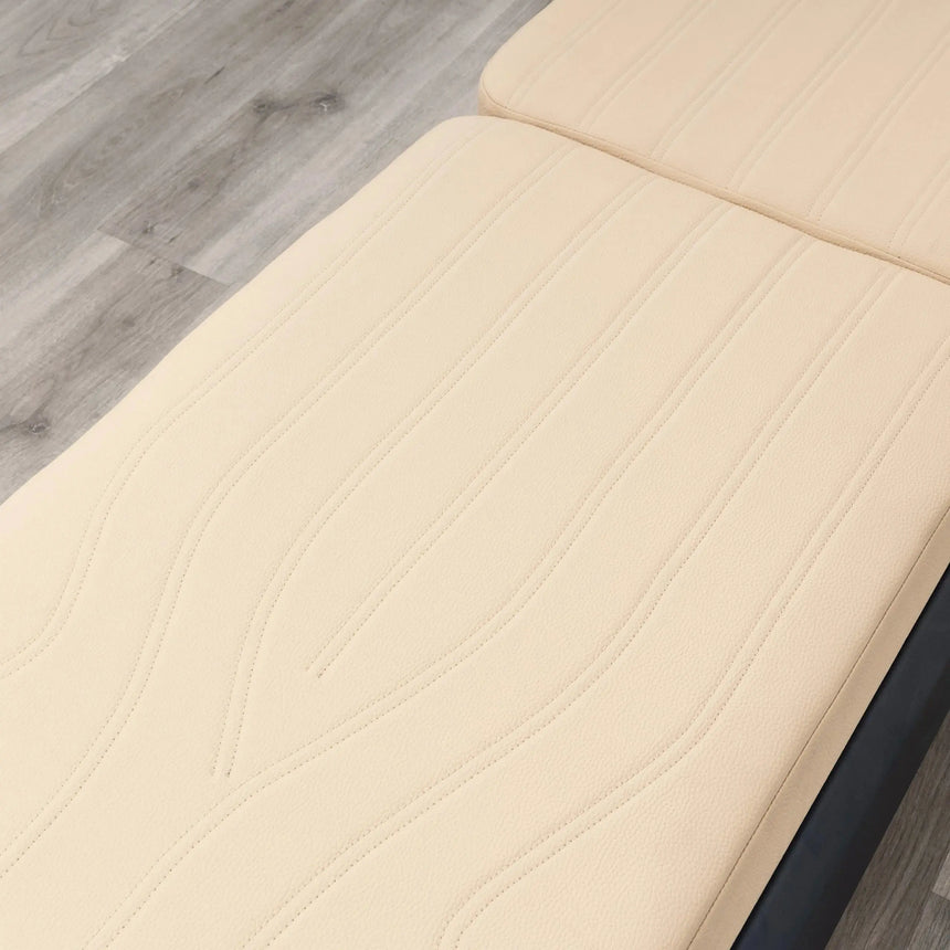 HEGREN Mat Converter TALMA placed on a Pilates Reformer, showcasing its cushioned surface and beige upholstery.