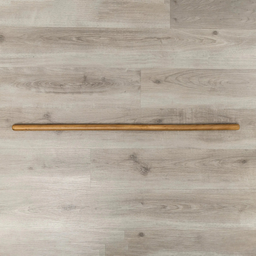 HEGREN Pilates Wooden Stick (1.10m) designed to enhance balance and flexibility during Reformer exercises