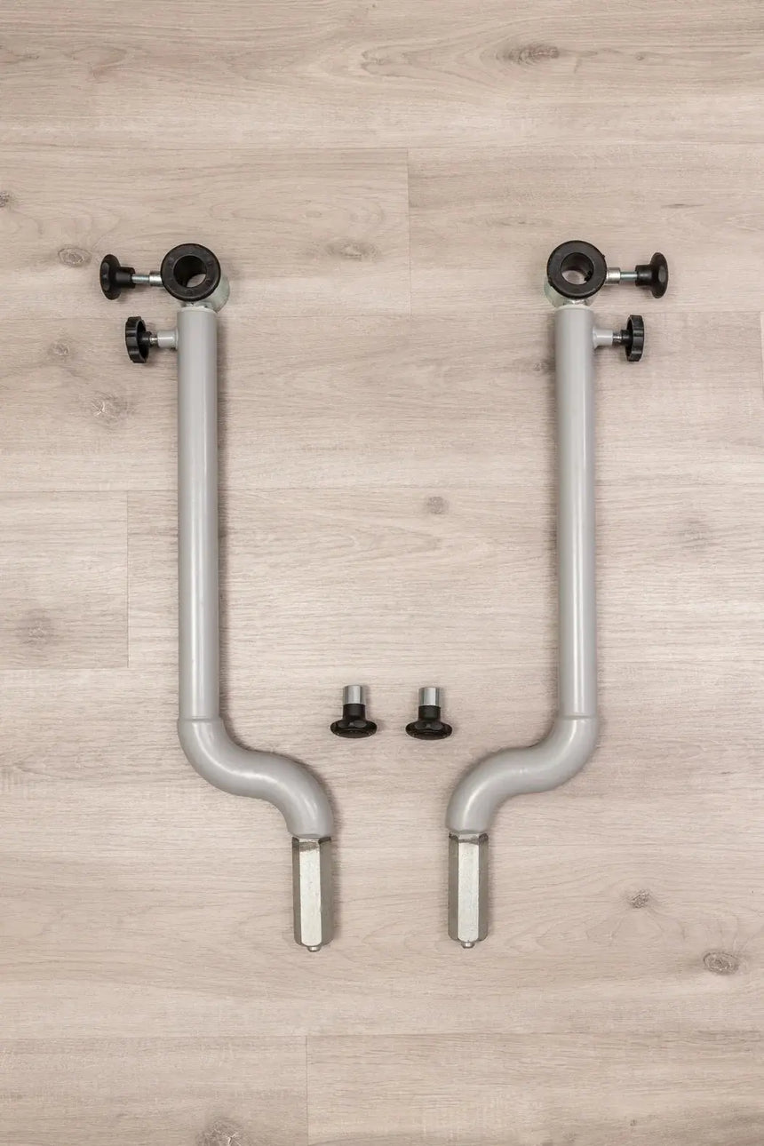 HEGREN Stability Bar Stand mounted on a wall, designed to securely hold the Stability Bar when not in use.
