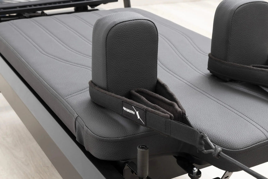 HEGREN Pilates Reformer TALMA 62 Black Elegance showcasing its black steel frame and black upholstery.