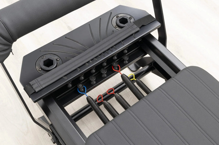 HEGREN Pilates Reformer TALMA 62 Black Elegance showcasing its black steel frame and black upholstery.