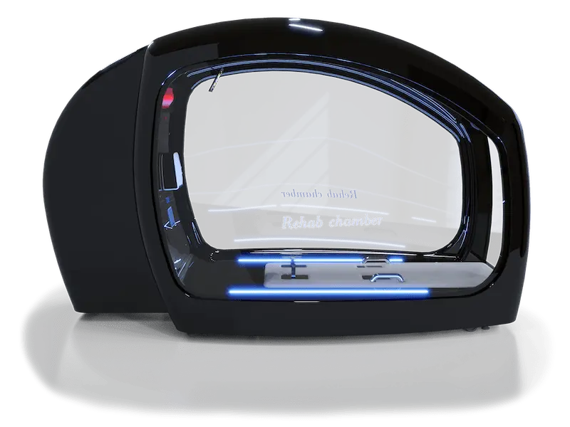 A sleek black rehabilitation chamber with a futuristic design, featuring a large curved glass front with "Rehab chamber" written on it. The interior is illuminated with blue LED lights, showcasing a modern and advanced setup ideal for therapeutic purposes.