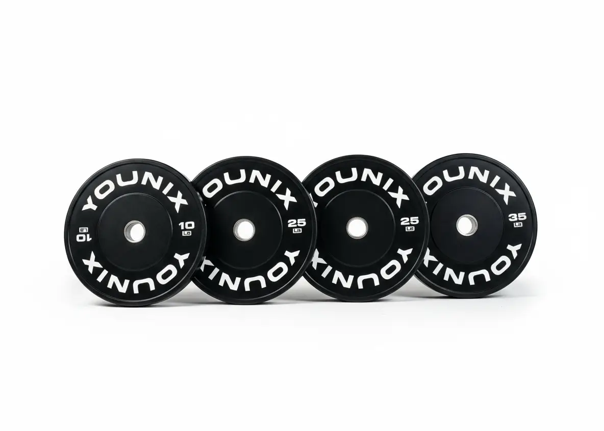 Younix Premium Bumper Plate 20 kg Hantelscheibe, vier schwarze Scheiben in einer Reihe vor weißem Hintergrund