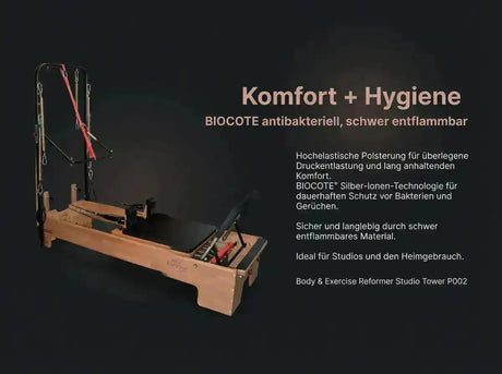 Wooden exercise reformer with BIOCOTE antibacterial technology on a dark background