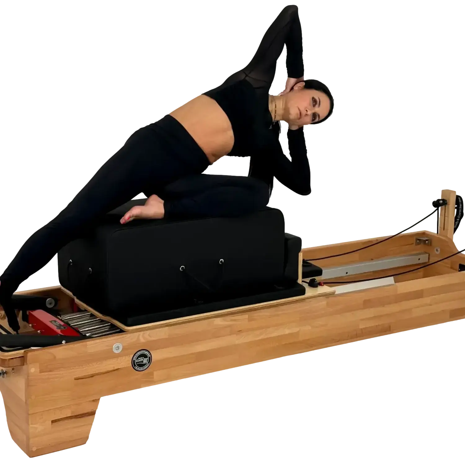Person using a Pilates reformer machine on a white background