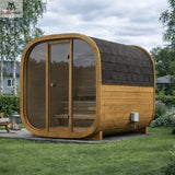 Wooden outdoor sauna with glass doors in a garden setting