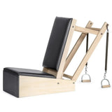 Elina Pilates Baby Chair aus Ahornholz – Seitenansicht mit schwarzem Polster und Federn