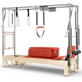 Elina Pilates Cadillac Reformer aus Ahornholz, Seitenansicht mit Polstern in Rot und Trapez-Rahmen aus Aluminium