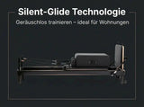 Elina Pilates Nubium Black Edition Reformer aus schwarzem Aluminium in Seitenansicht vor dunklem Hintergrund, Gleitsystem