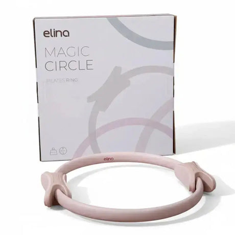 Elina Pilates Pilates-Ring in Zartrosa vor der weißen Verpackung, Frontansicht auf weißem Hintergrund