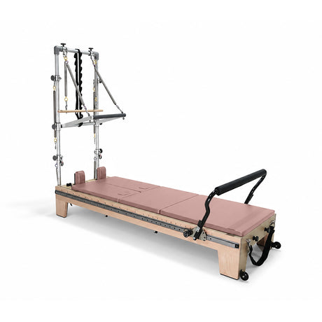 Elina Pilates Twin Reformer with dusky pink padding, side view with tower on a white background