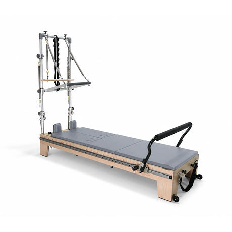 Elina Pilates Twin Reformer with gray padding, side view with tower on a white background