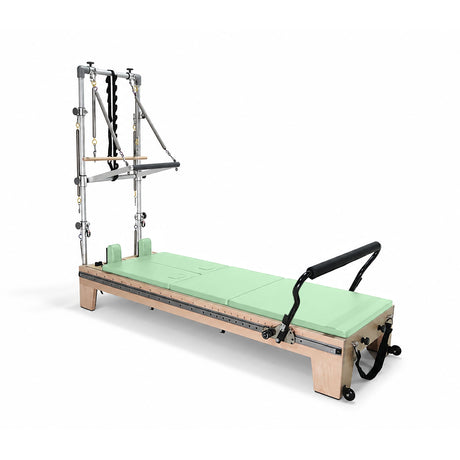 Elina Pilates Twin Reformer with green padding, side view with tower on a white background