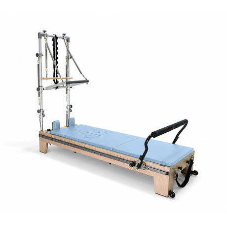 Elina Pilates Twin Reformer with ocean-blue padding, side view with tower on a white background