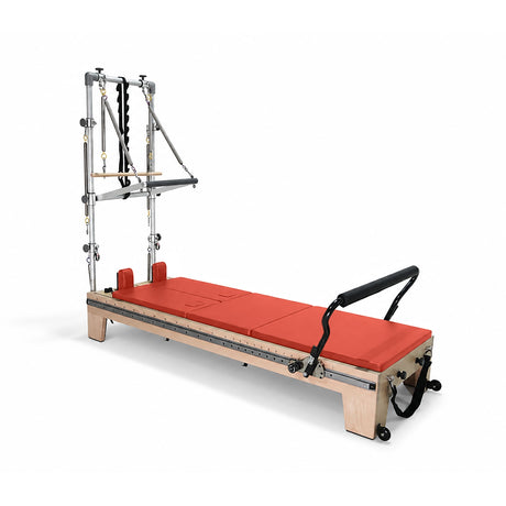 Elina Pilates Twin Reformer with red padding, side view with tower on a white background