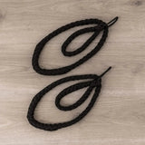 Hegren Double Loop Ropes, Paar schwarze geflochtene Schlaufen auf Holzboden, Draufsicht