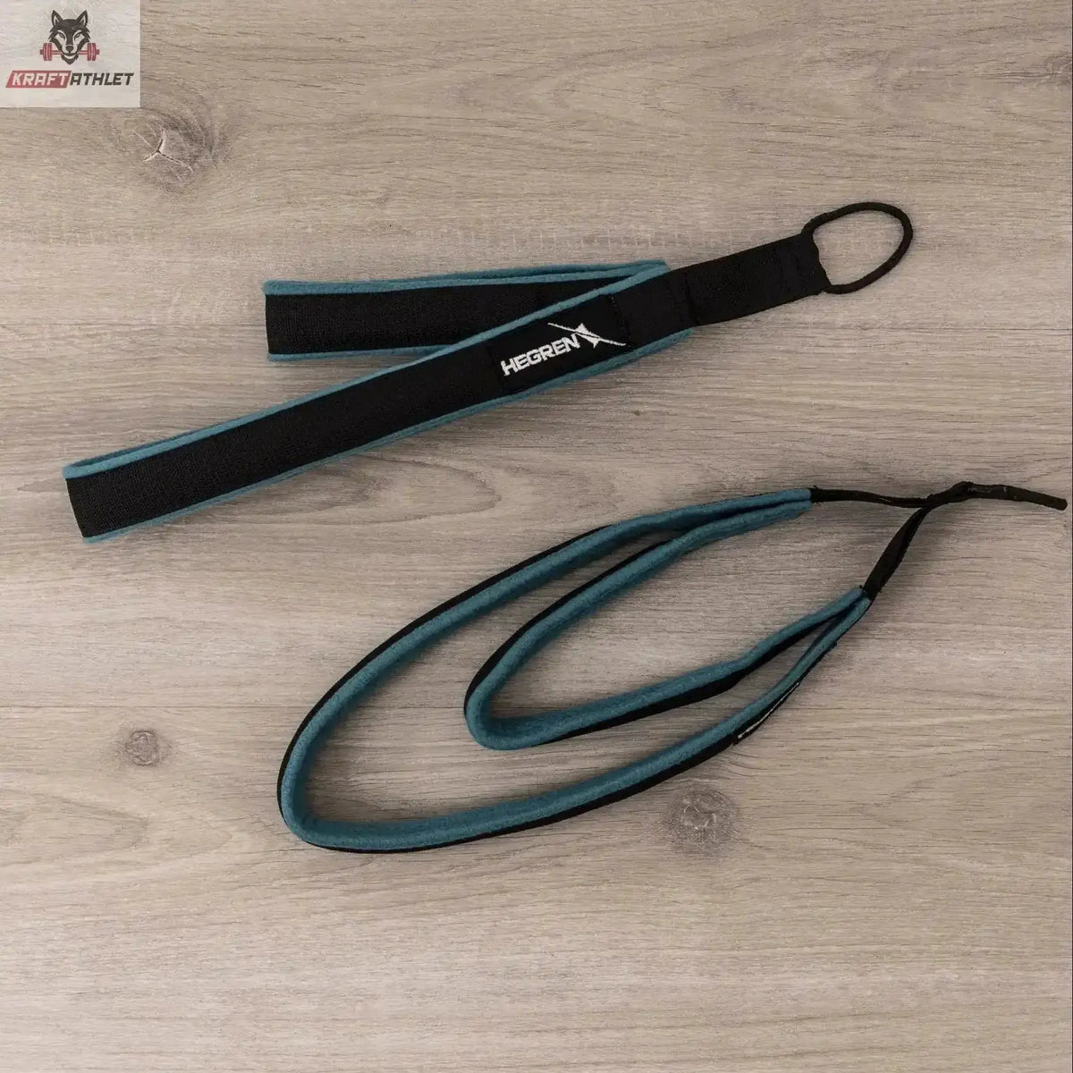 Hegren Double Loop Straps, Schlaufe mit Seil in Schwarz-Türkis auf Holzboden