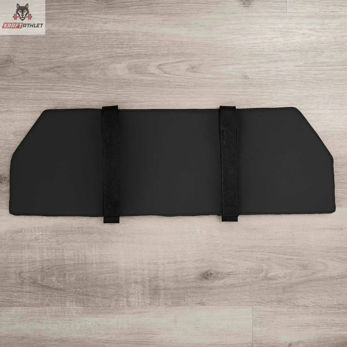 Hegren Platform Pad TALMA Reformer-Auflage, Draufsicht in Schwarz mit Fixiergurten auf Holzboden
