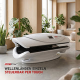 ProReset AuraLight Rotlichtbett in einer hellen Recovery-Lounge