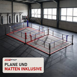 SportCom Doppel-Boxring Bodenpfosten mit Spannseilen in einer hellen Kampfsporthalle