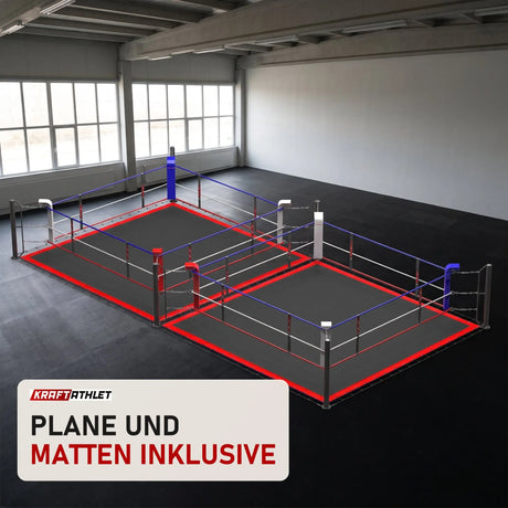 SportCom Doppel-Boxring mit Spannseilen und Stahlpfosten in einer hellen Kampfsporthalle