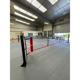 SportCom Ecofix Boxring bodenmontiert in einer Halle, rote Ecke im Vordergrund