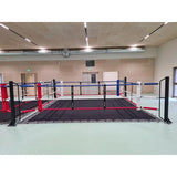 SportCom Ecofix Doppel-Boxring mit Aluminiumrand, in einer Halle mit roten und blauen Eckpolstern