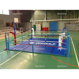 SportCom Flexi-Roll Mattenfläche für Boxringe in Blau im Podestring einer Sporthalle