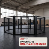 SportCom MMA-Käfig Oktagon zur Bodenmontage in einer hellen Kampfsporthalle