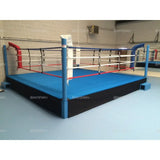 SportCom Pro-Trainingsboxring mit 50 cm Podium, mit blauem Boden und blauer Ecke, schräg
