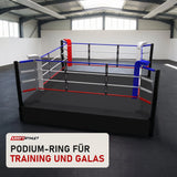 SportCom Pro-Trainingsboxring mit 50 cm Podium in einer hellen Kampfsporthalle