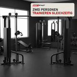 Titanium Strength Black Series 2-Station Cable Crossover in einem fertig eingerichteten Studio mit dunklen Wänden und Gummiboden