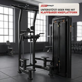 Titanium Strength Genesis Series Klimmzug-Dipsmaschine in einem fertig eingerichteten Studio mit dunklen Wänden und Gummiboden