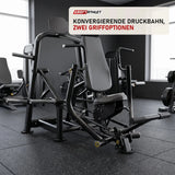 Titanium Strength Genesis Series IsoLateral Konvergente Brustpresse in einem fertig eingerichteten Studio mit dunklen Wänden und Gummiboden