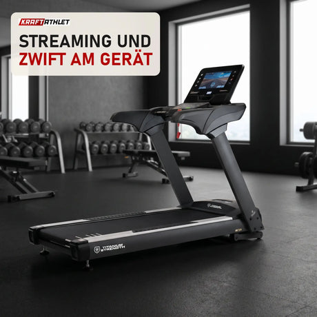 Titanium Strength TM900 TFT Laufband mit 16-Zoll-Touchscreen in einem fertig eingerichteten Studio mit dunklen Wänden und Gummiboden